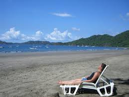 Person lying on the beach at Playa Hermosa Costa Rica