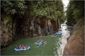 Groups of people rafting on the Corobici river in Costa Rica