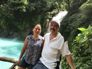 Couple enjoying Rio Celeste waterfall