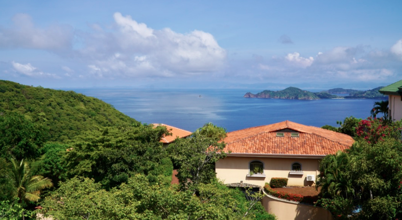 View of a Playa Hermosa luxury home from the side of a hill