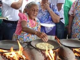 Elderly woman cooking tortillas in Costa Rica
