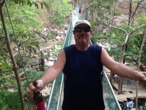 On a walking bridge above the rainforest