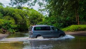Van driving through a small river in Costa Rica