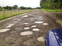 Dirt road with large potholes in Costa Rica